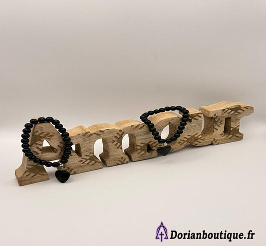 Bracelet oeil de tigre noir et son coeur.